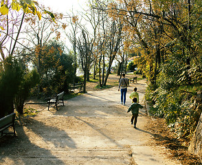 Image showing cute family going away in green park, lifestyle people concept