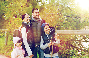 Image showing happy family with backpacks hiking