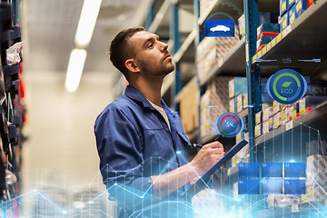 Image showing auto mechanic with clipboard at car workshop