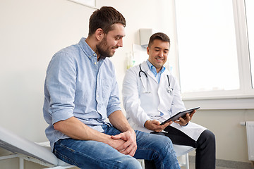 Image showing doctor with tablet pc and male patient at hospital