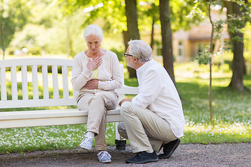 Image showing senior woman feeling sick at summer park