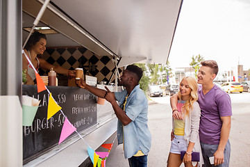 Image showing happy customers queue at food truck