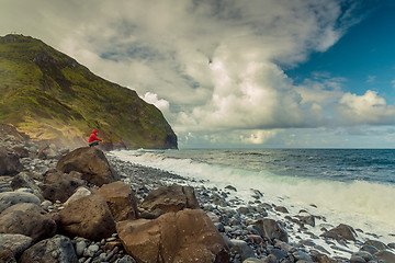 Image showing Woman on the beach at a cold day