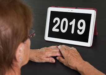 Image showing Senior lady relaxing and her tablet - 2019