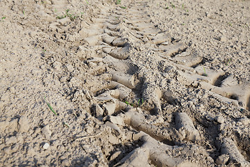 Image showing Wheel tracks on the field