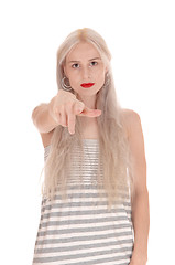 Image showing Serious woman pointing finger at camera