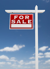 Image showing Left Facing For Sale Real Estate Sign on a Blue Sky with Clouds.