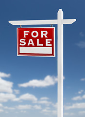 Image showing Left Facing For Sale Real Estate Sign on a Blue Sky with Clouds.