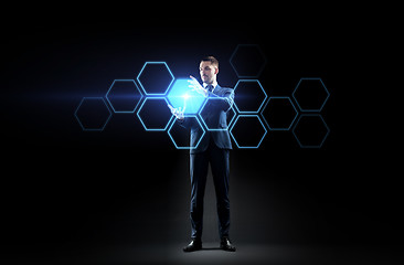 Image showing businessman working with virtual network hologram