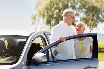 Image showing happy senior couple with car in summer