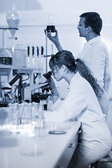 Image showing Health care professionals microscoping in scientific laboratory.