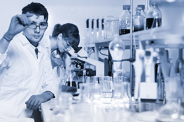 Image showing Health care professionals microscoping in scientific laboratory.