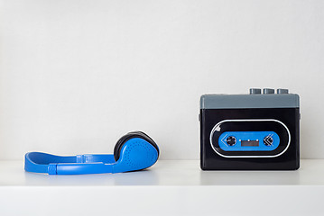 Image showing Retro cassette player and headphones on the shelf