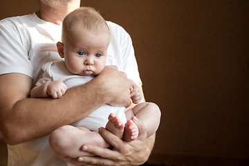 Image showing Father Holding Newborn Baby Son