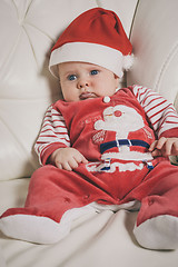 Image showing Happy  baby in Santa costume. 