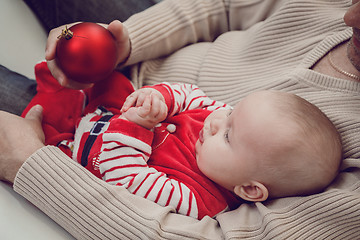 Image showing Happy  father having fun with newborn baby son, family portrait 