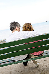 Image showing Mature romantic couple on a bench