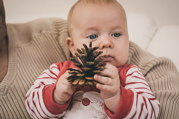 Image showing Happy  father having fun with newborn baby son, family portrait 