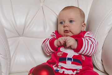 Image showing Happy  baby in Santa costume. 