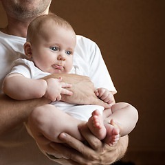 Image showing Father Holding Newborn Baby Son