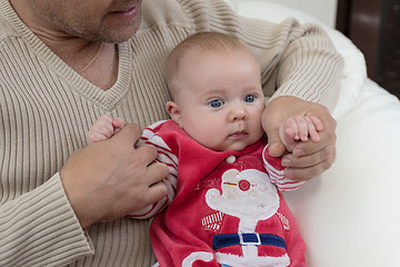 Image showing Happy  father having fun with newborn baby son, family portrait 