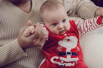 Image showing Happy  father having fun with newborn baby son, family portrait 