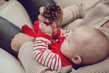 Image showing Happy  father having fun with newborn baby son, family portrait 