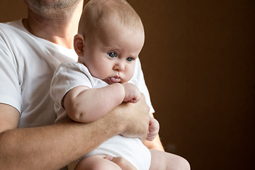 Image showing Father Holding Newborn Baby Son