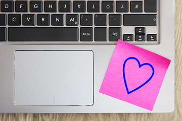 Image showing Laptop keyboard with heart note