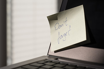 Image showing Laptop with note Don\'t forget