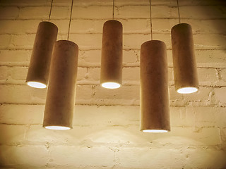 Image showing Concrete industrial design lamps in sepia tones