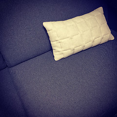 Image showing Dark purple sofa with white cushion