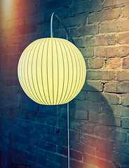 Image showing Retro style image of a wall lamp with round lampshade