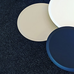 Image showing Set of round tables on a carpet floor