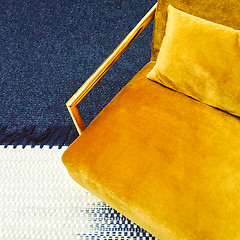 Image showing Retro style dark yellow velvet armchair