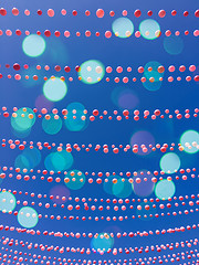 Image showing Blue sky background with balloon decorations and bokeh lights