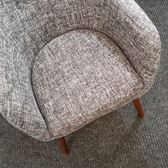 Image showing Stylish gray armchair on carpet floor