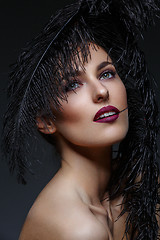 Image showing Beautiful girl with black feathers