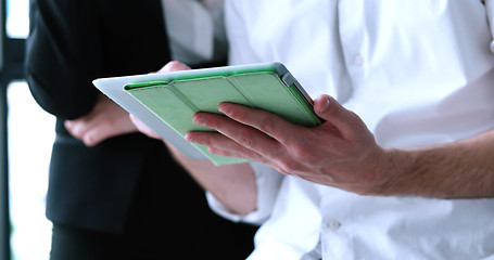 Image showing low angle shot of business people using technology