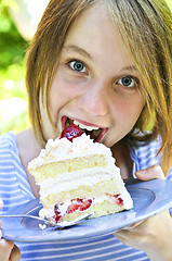 Image showing Girl eating a cake