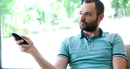 Image showing Happy Man Watching Television