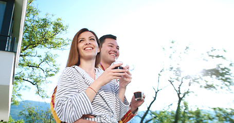 Image showing drinking coffee on terrace of villa in the morning