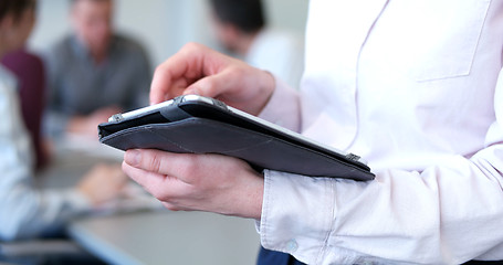 Image showing Businessman using tablet in modern office