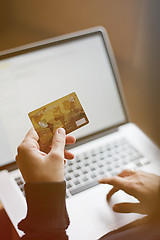 Image showing Woman using credit card for online purchase