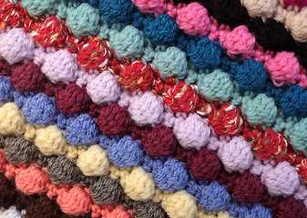 Image showing Diagonal stripes of multi-coloured bobble crochet stitches backg