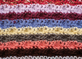 Image showing Horizontal stripes of coloured crochet stitches background