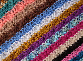 Image showing Diagonal stripes of crocheted stitches in multi-coloured wool ba