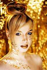 Image showing beauty blond woman with gold creative make up