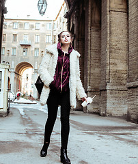 Image showing young pretty stylish teenage girl outside on city street fancy f