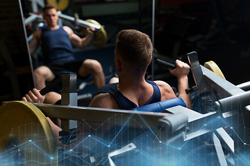 Image showing man doing chest press on exercise machine in gym